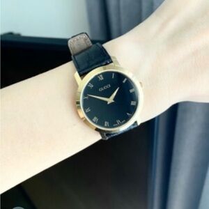 Gucci Gold and Black Leather Watch